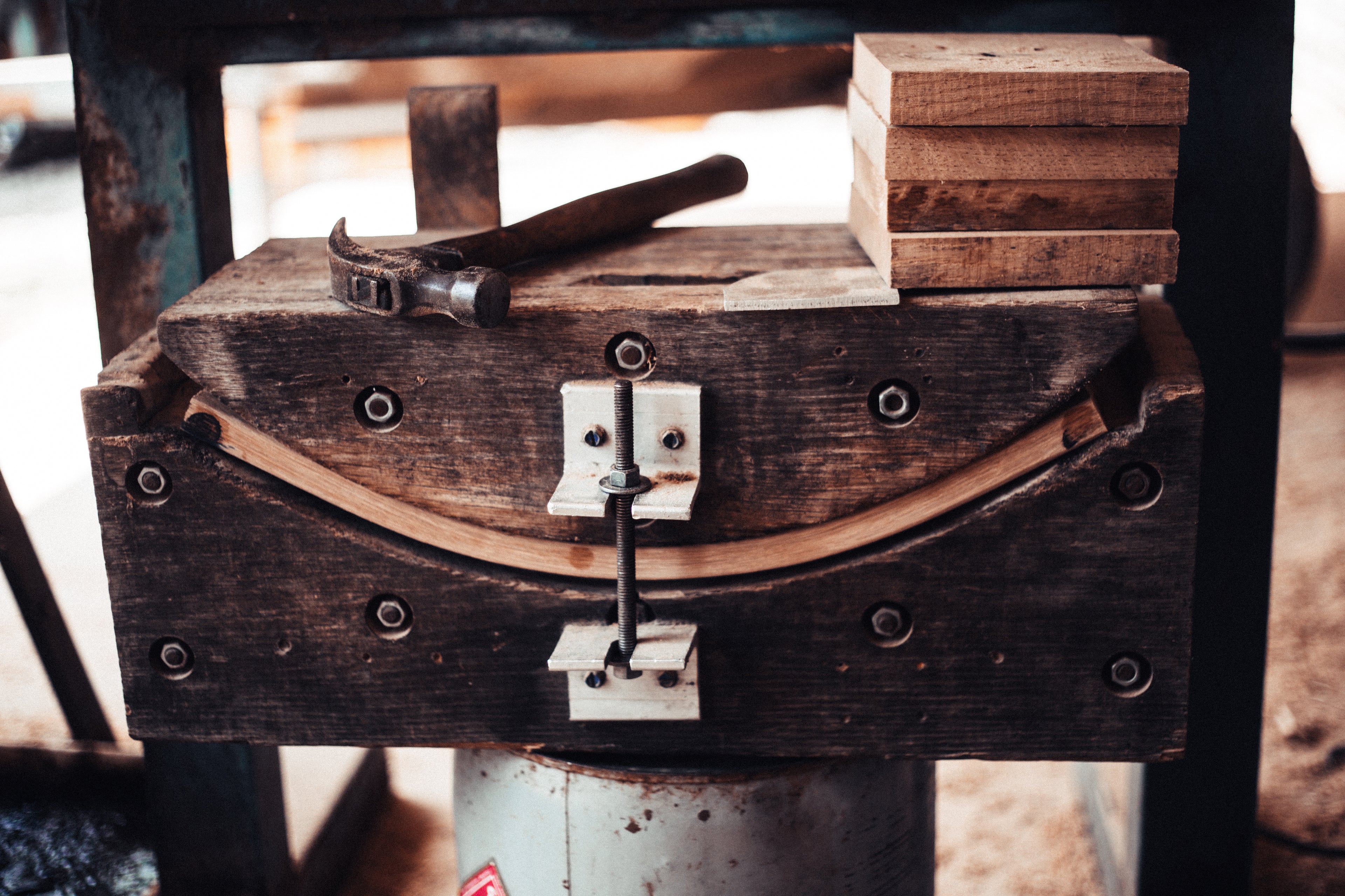 A steam bending machine creating an Oak curve for a Classic Oak Folding Kermit Chair, made in the USA.